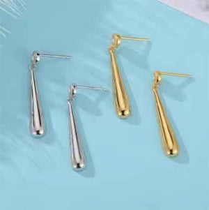 silver drop earrings and gold