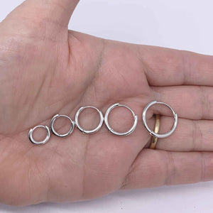 silver hoop huggie earrings frenelle hand