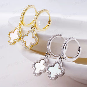 gold white huggie earrings two