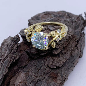 gold moissanite dress ring with leaf design by frenelle jewellery