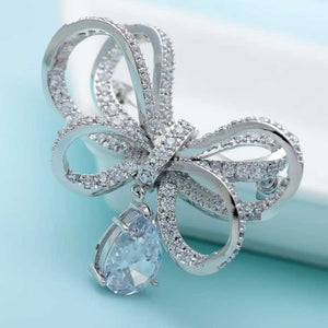 silver bow brooch crystal