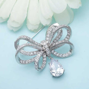 silver bow brooch crystal
