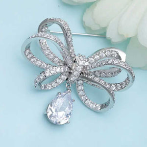 silver bow brooch crystal