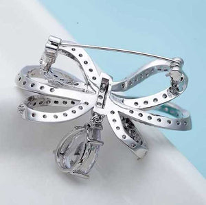 silver bow brooch crystal