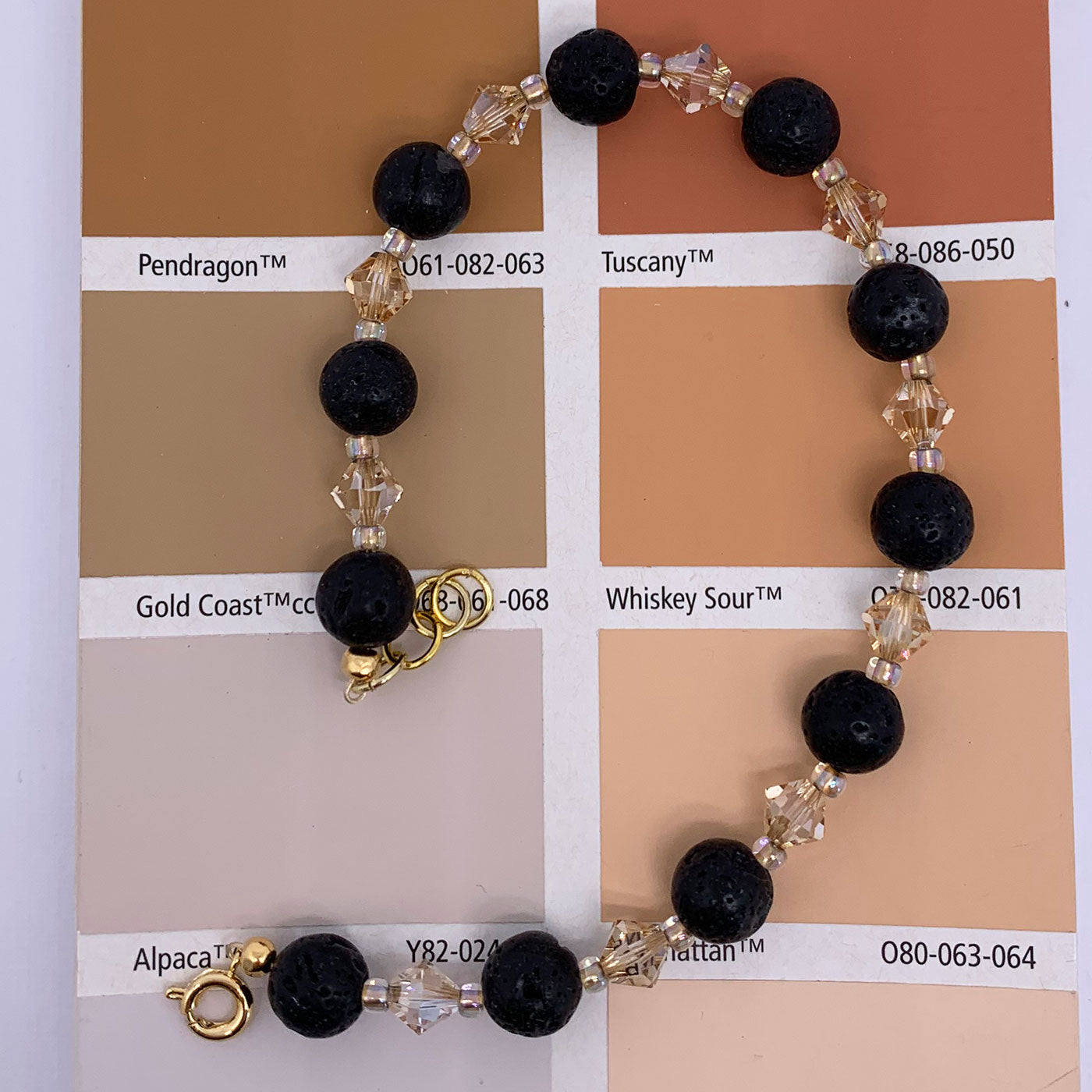 gold black lava bead bracelet