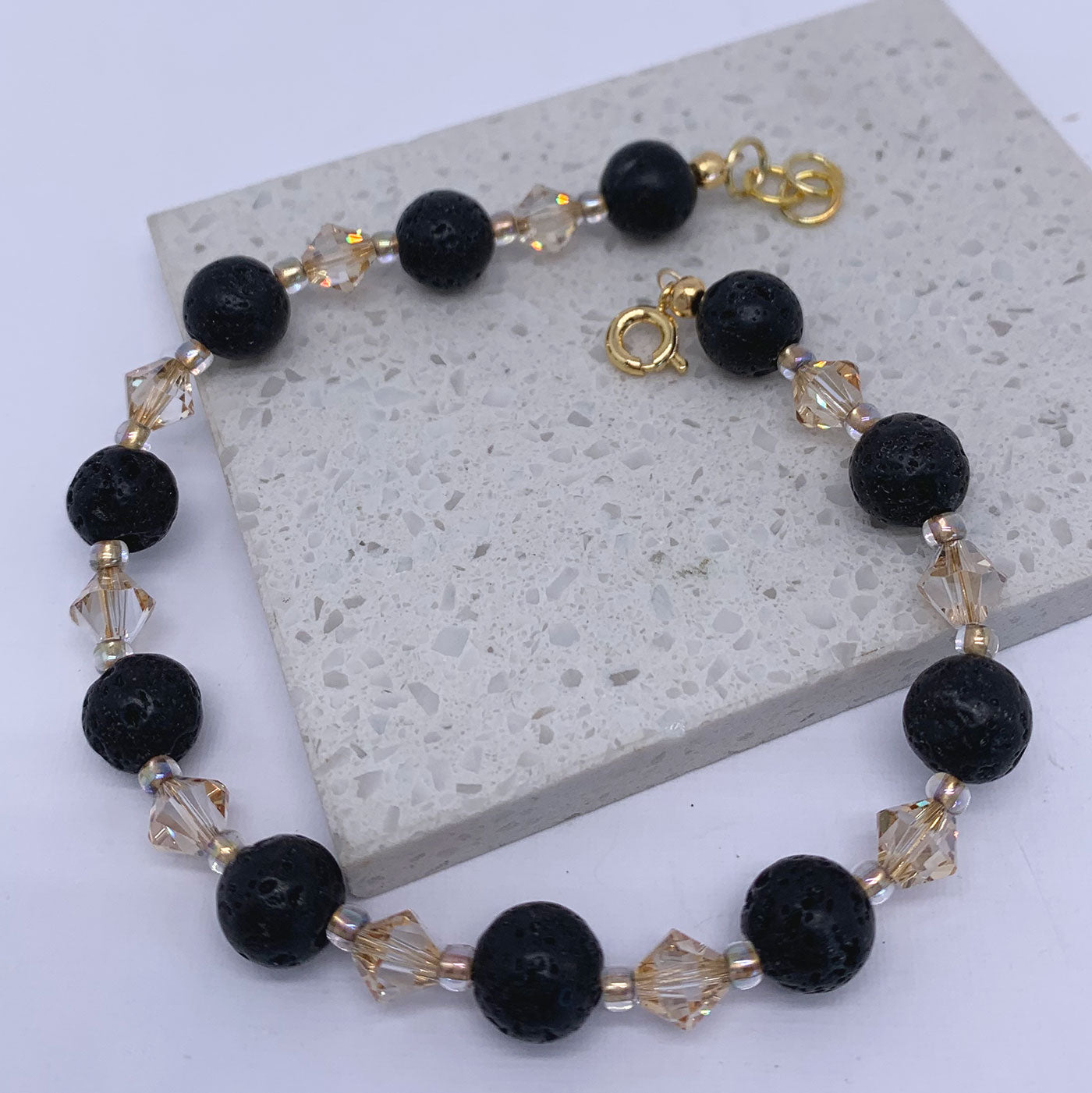 gold black lava bead bracelet