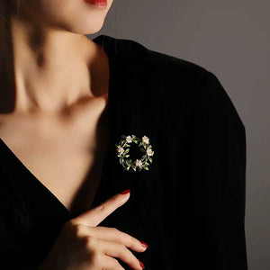 flower wreath brooch on model