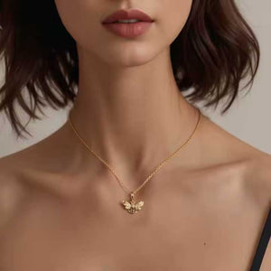 gold bee charm on model