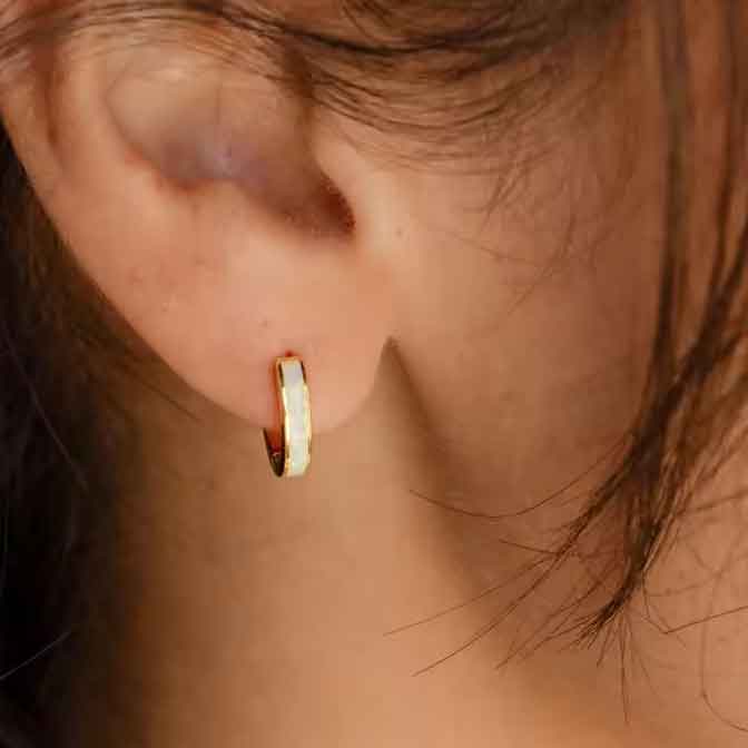 gold opal huggie earring ear