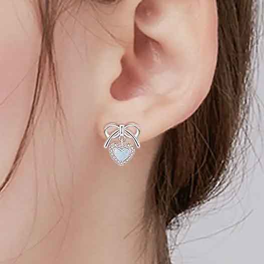 silver bow heart opal earrings