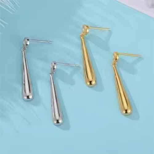 silver drop earrings and gold