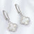 silver white huggie earrings