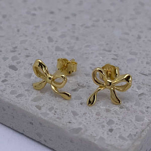 gold blow stud earrings