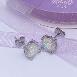 Silver OPal stud earrings ribbon