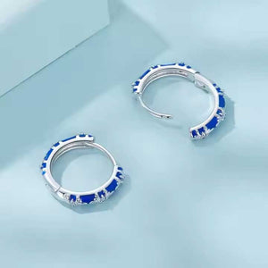 Blue silver huggie earrings embossed