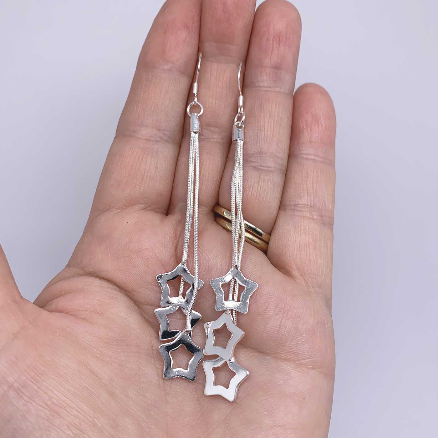 silver matariki star dangle earrings frenelle jewellery