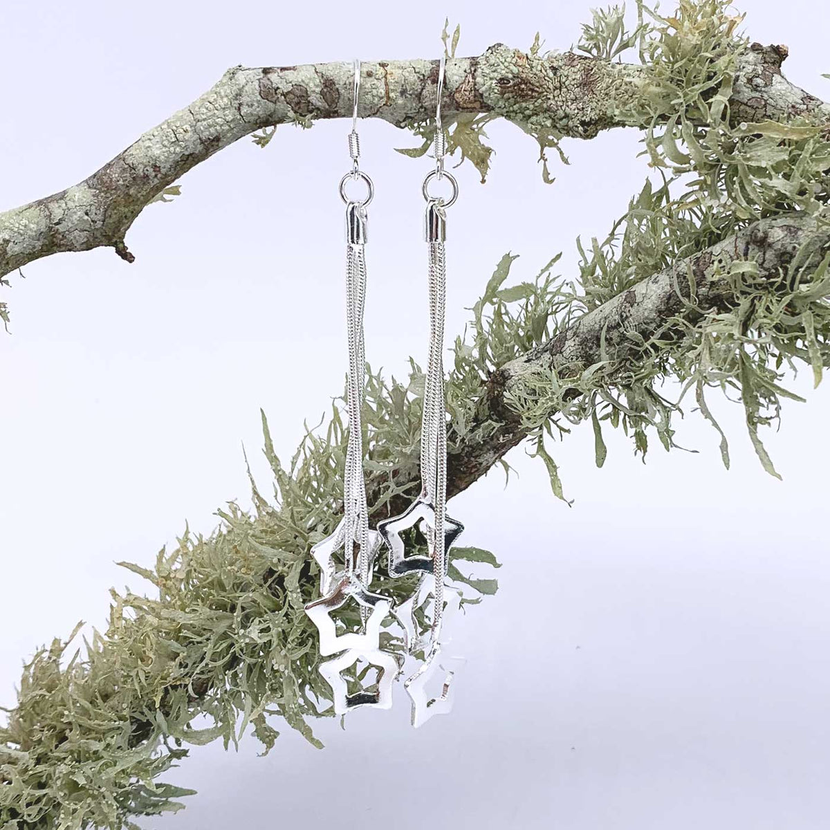silver matariki star dangle earrings frenelle jewellery