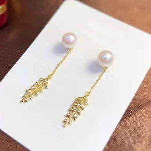 Gold Stud Pearl Earrings with hanging leaf "Nirilla"