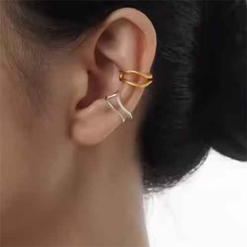 gold double ear cuff on ear