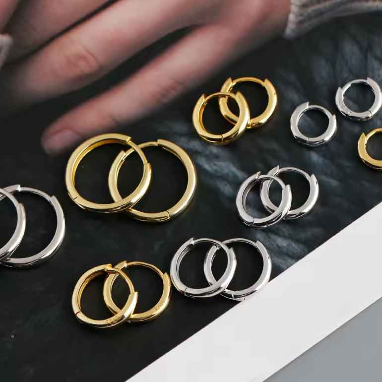 silver hoop huggie earrings gold