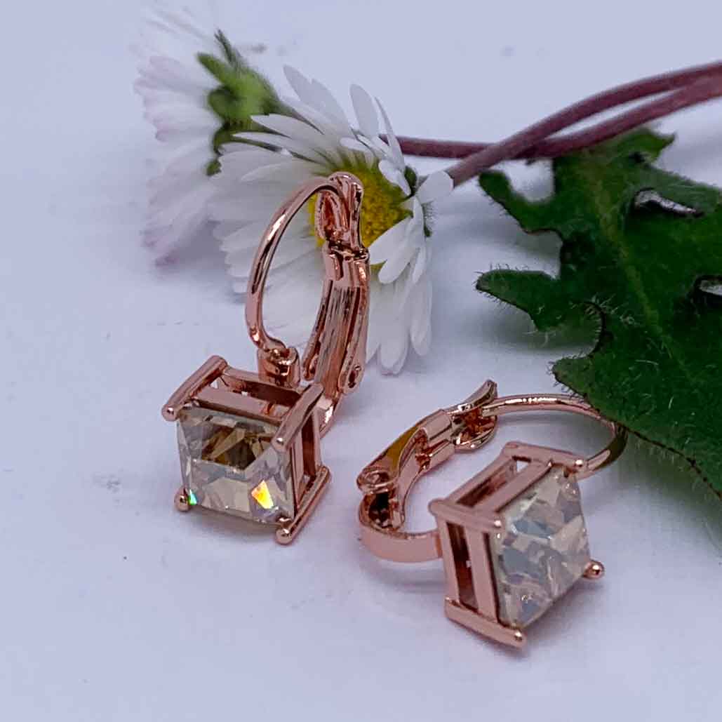 rose gold leverback earrings with daisy