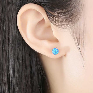 silver blue opal earrings in ear