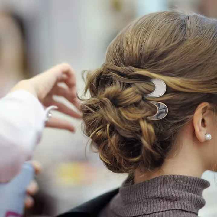 gold fork hair accessory in hair