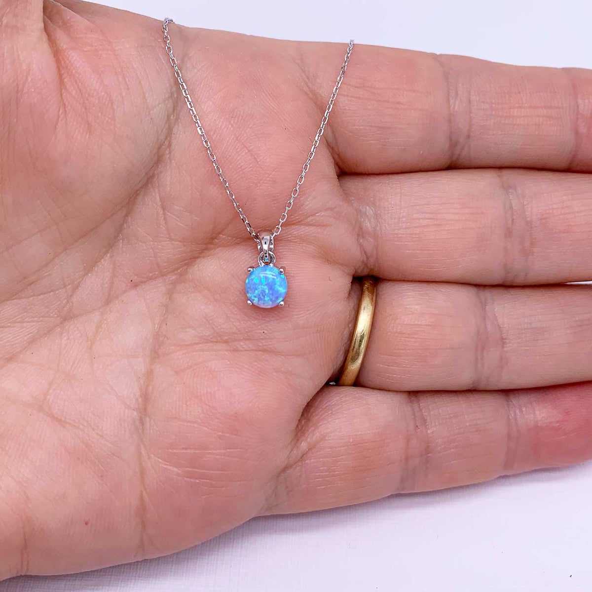 blue silver opal necklace hand