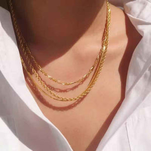 gold figaro chain layered