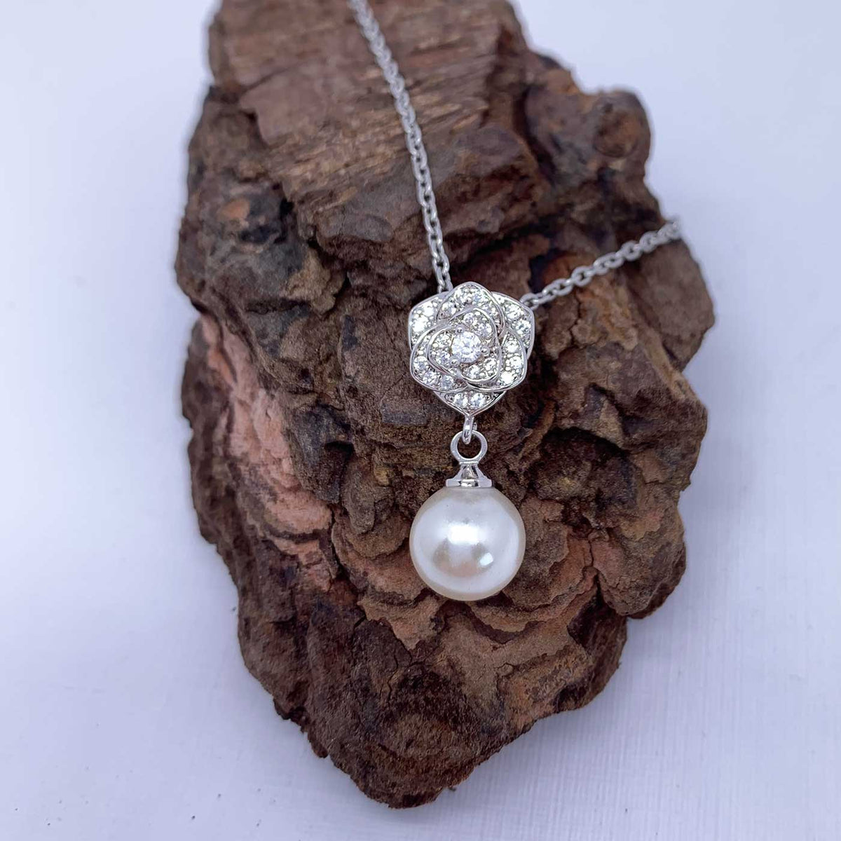 silver pearl rose necklace close up