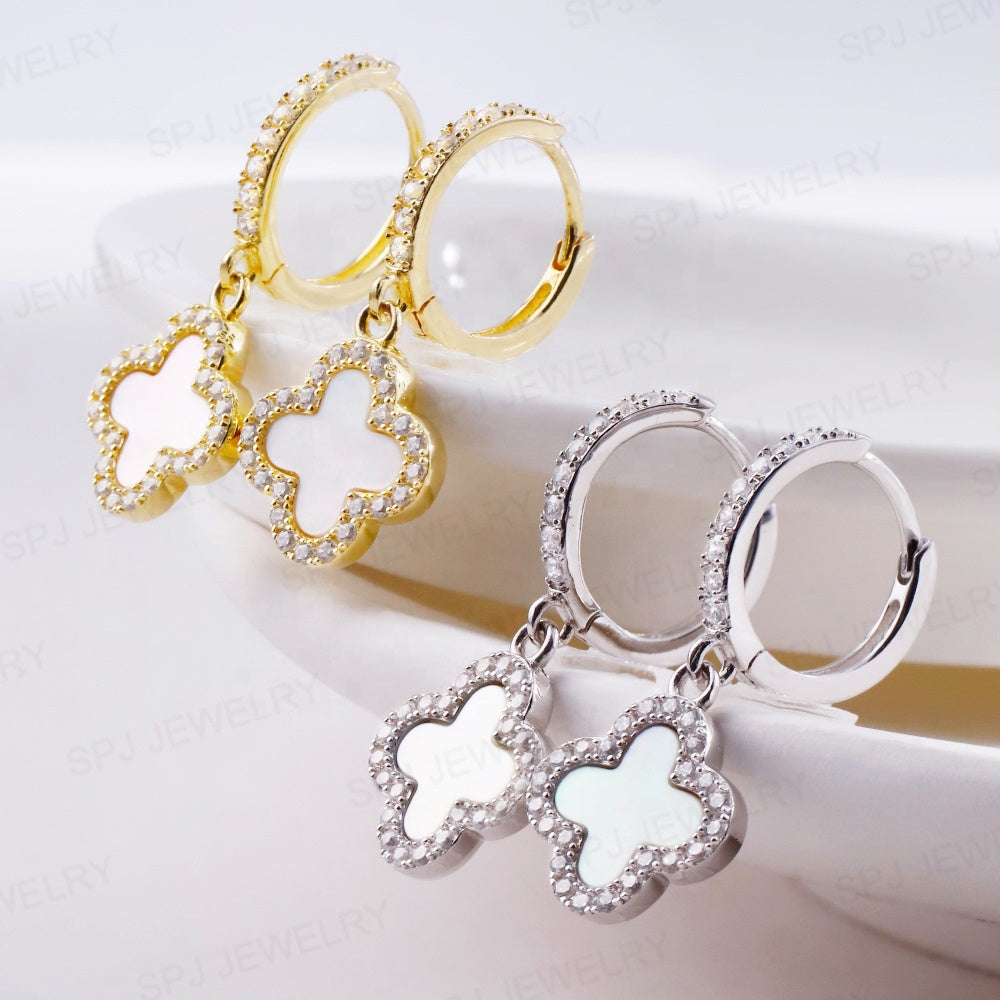 gold white huggie earrings two