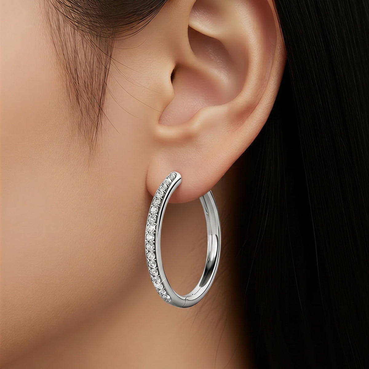 silver hoop earring on woman frenelle