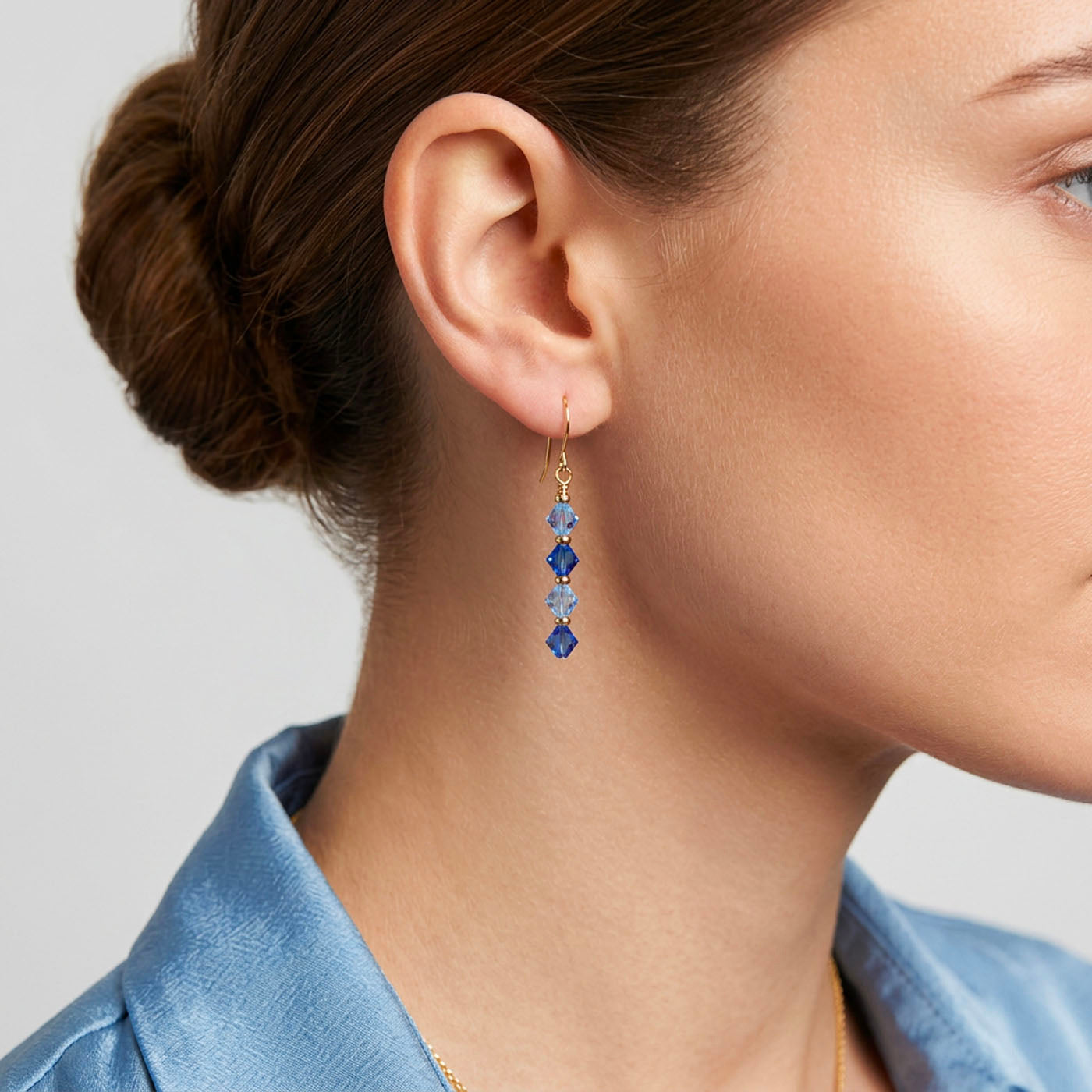 gold drop earrings with blue swarovski crystals frenelle jewellery