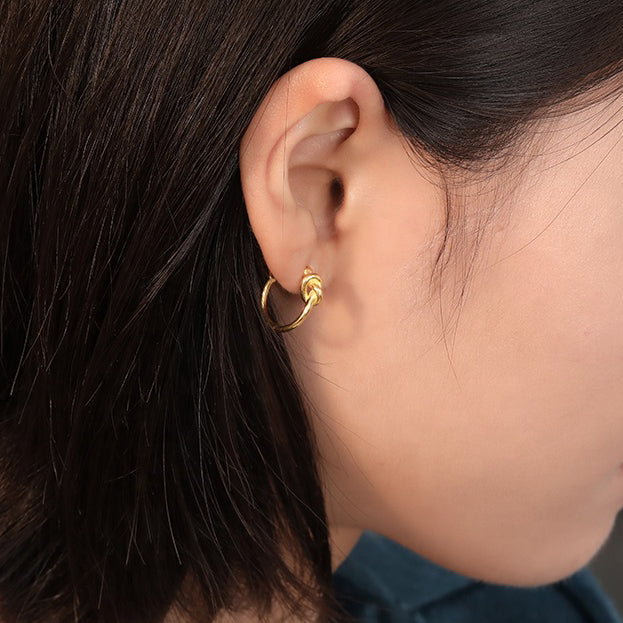 gold knotted hoop earrings frenelle jewellery