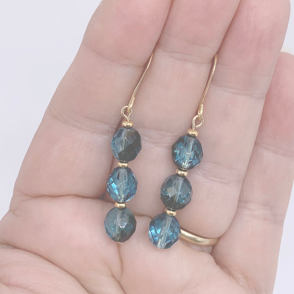 teal blue drop earrings with gold fittings frenelle jewellery