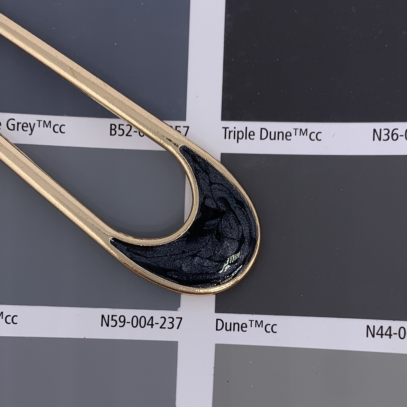 gold enamel hair fork