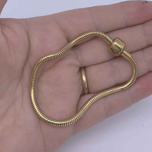 gold charm bracelet hand