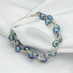 peacock pearl bracelet on cloth