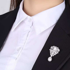 silver pearl crystal brooch on coat