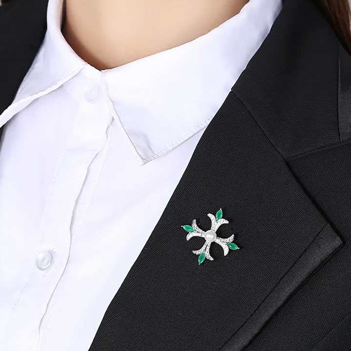 cross shaped brooch green crystals