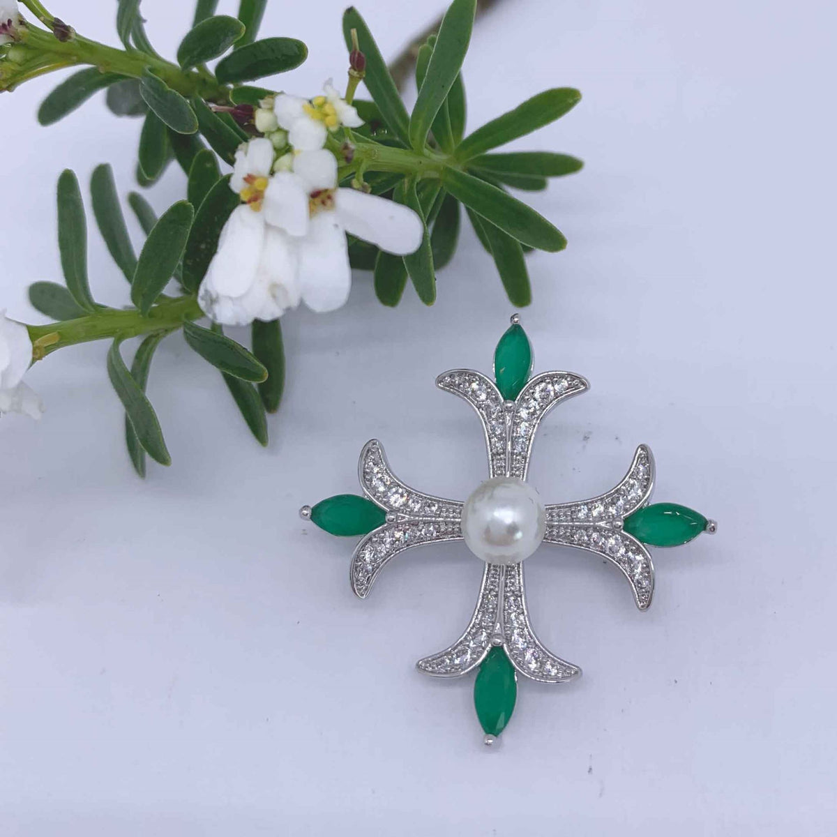 cross shaped brooch green crystals