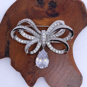 silver bow brooch crystal