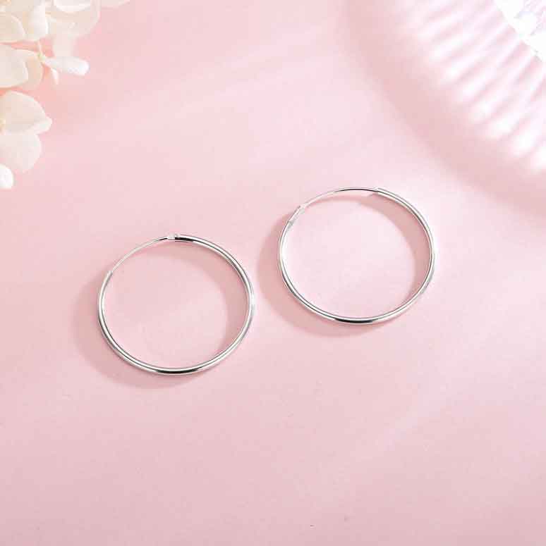 Silver hoop earrings pink