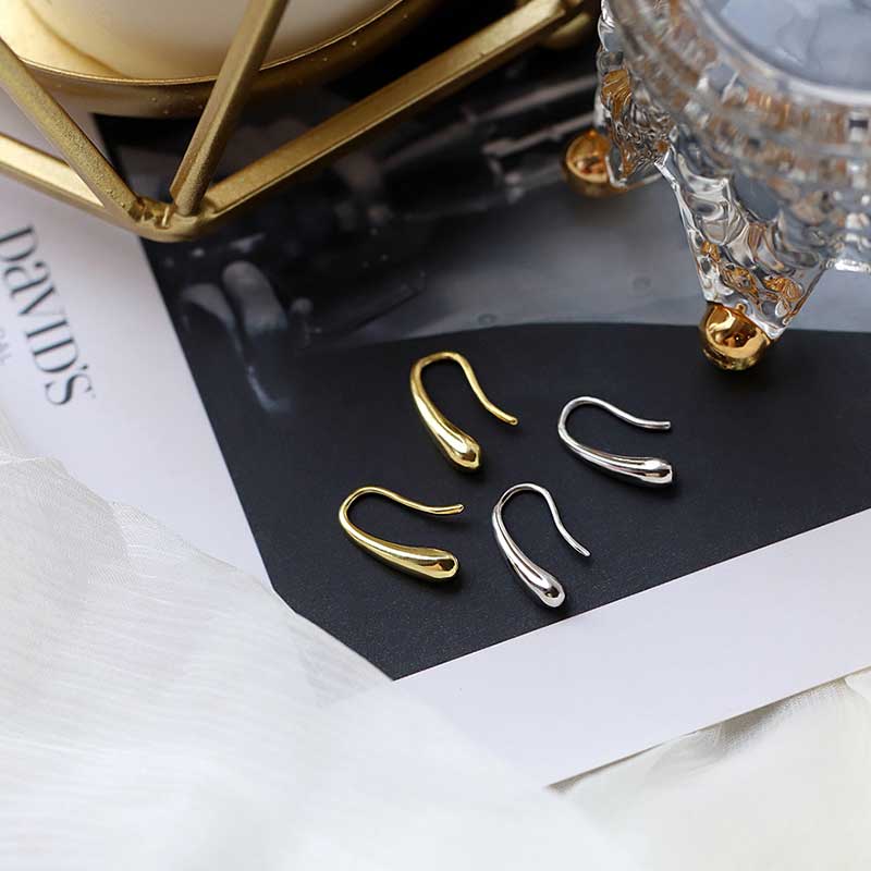 gold teardrop earrings both colours