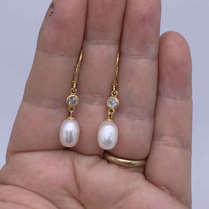 gold pearl drop bridal earrings hand