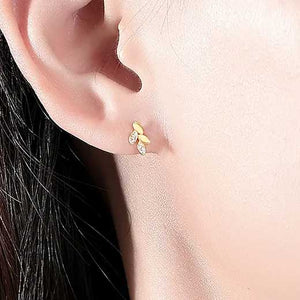 gold stud earrings ear