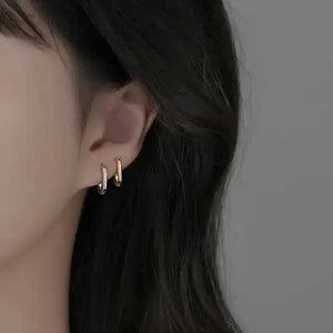 gold huggie earrings ear