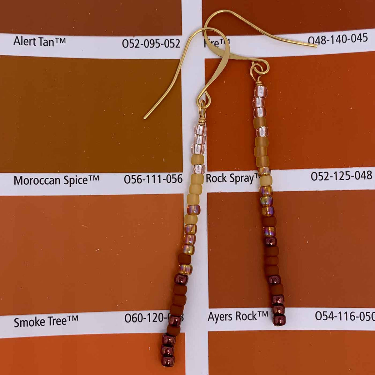 red bead tassel earrings resene