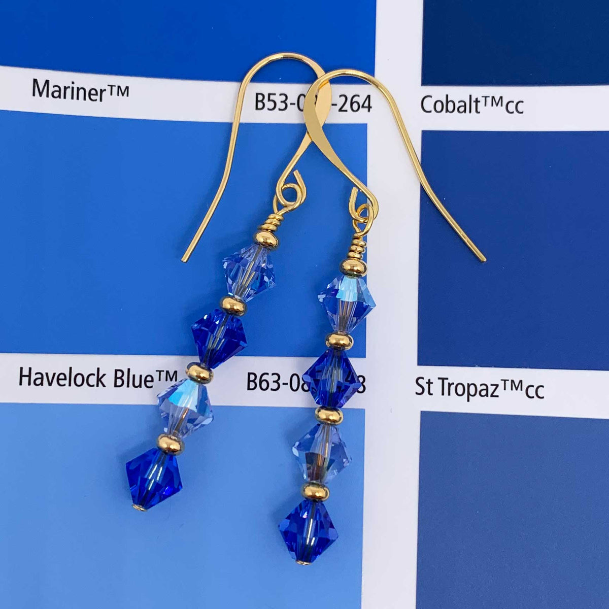 gold drop earrings with blue crystals