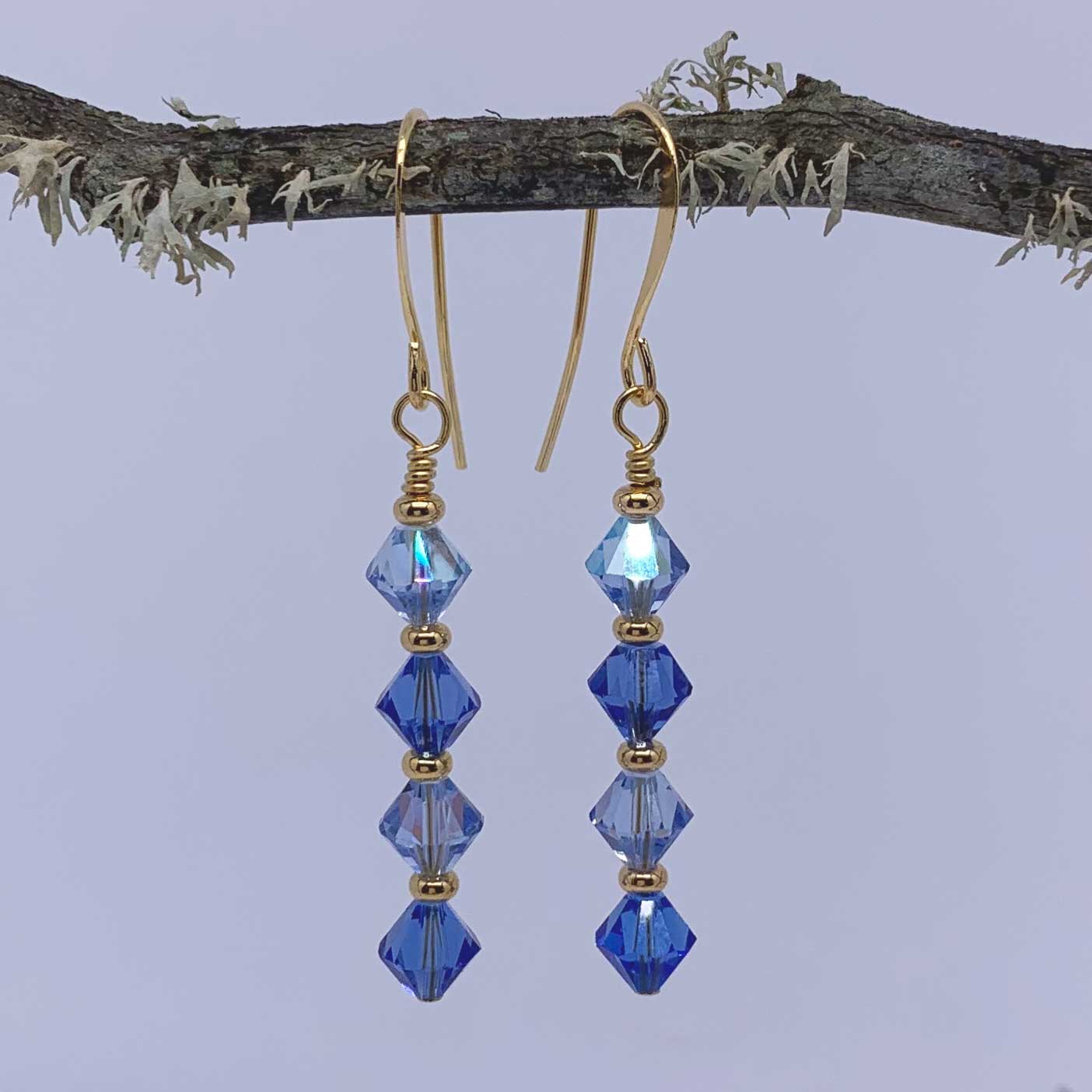 gold drop earrings with blue crystals